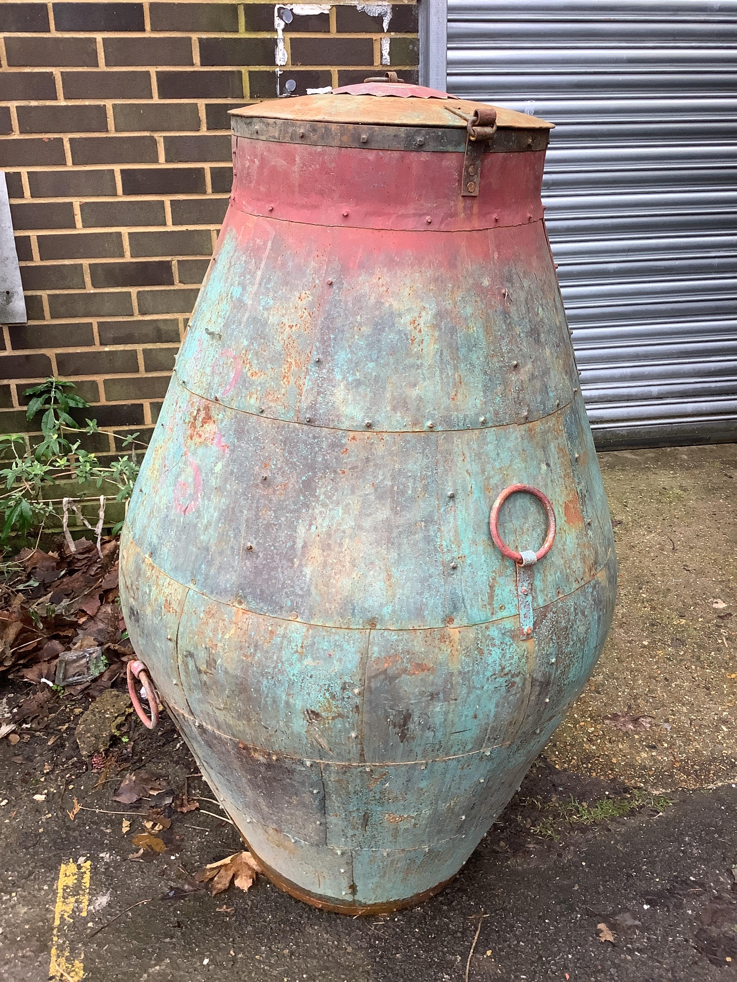 A riveted metal lidded barrel, height 127cm