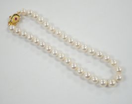 A Butler & Wilson single strand cultured pearl necklace, with enamelled and gem set bug clasp,