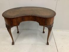 An early 20th century Chippendale revival mahogany kidney shape writing table, width 106cm, depth