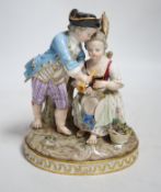 A Meissen group of a boy and a girl with a piccolo, 19th century, the oval base modelled with two