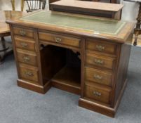 A late Victorian walnut kneehole desk, width 114cm, depth 56cm, height 76cm