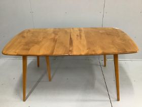 An Ercol elm and beech rectangular extending dining table, 224cm extended, width 88cm, height 71cm