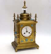 A brass French mantel clock (missing bell and pendulum), 35cm high