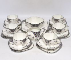 A Shelley ‘Black Leafy’ part tea set comprising trios, milk jug, bowl and sandwich plate