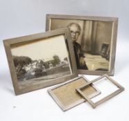 Four assorted early to mid 20th century silver mounted rectangular photograph frames, largest 28.