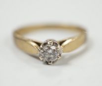 A yellow metal and solitaire diamond set ring, size N/O, gross weight 2.4 grams.