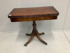 A reproduction Regency style mahogany folding tea table, width 85cm, depth 42cm, height 76cm