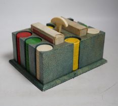 An Art Deco shagreen poker gaming set, ivory mounted with bakelite counters and two card packs by