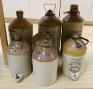 Seven various stoneware vessels including one Lewes brewer, largest 49cm high
