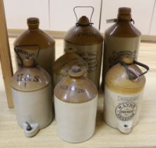 Seven various stoneware vessels including one Lewes brewer, largest 49cm high