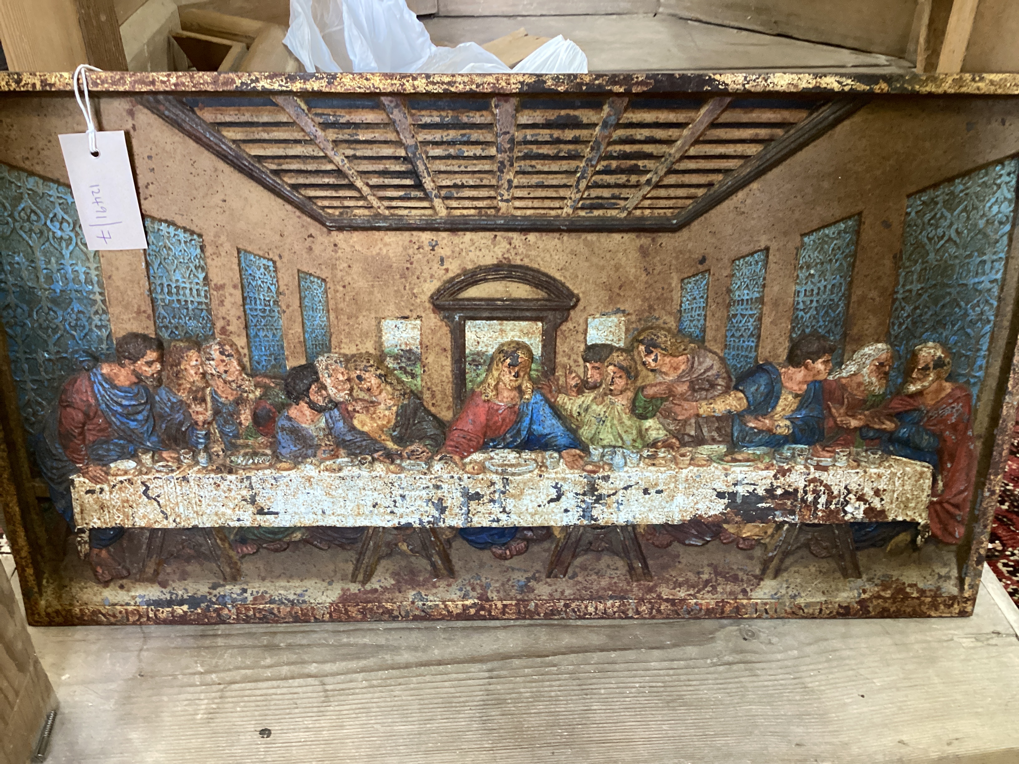 A rectangular Coalbrookdale cast iron panel of The Last Supper, later painted, width 66cm, height
