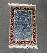 A North West Persian part silk blue ground mat, 90 x 60cm.