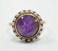 A mid 20th century 14k yellow metal, amethyst and seed pearl set circular cluster ring, size U/V,