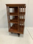 An early 20th century mahogany three tier revolving bookcase, width 60cm, depth 60cm, height 120cm