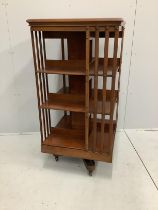 An early 20th century mahogany three tier revolving bookcase, width 60cm, depth 60cm, height 120cm