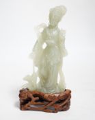 A Chinese celadon jade figure of a lady on wood stand,13cms high.