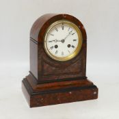 A late 19th century French rouge marble mantel clock, striking on a bell, with key, 24cm high