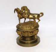 A late 19th century French ormolu dish and cover, surmounted by fighting stallions, 24cm high