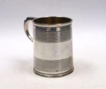 A Victorian reeded silver christening mug, William Evans, London, 1878, 87mm.