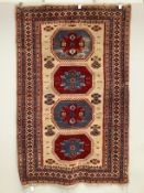 A Caucasian style fawn ground rug, 200 x 132cm