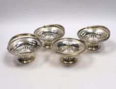 A set of four Edwardian pierced silver circular bonbon baskets, William Neale, Birmingham, 1908,