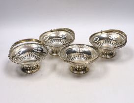 A set of four Edwardian pierced silver circular bonbon baskets, William Neale, Birmingham, 1908,