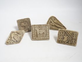 A group of five Middle eastern pottery moulds/stamps, largest10cm long