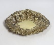 A late Victorian embossed silver gilt oval dish, by Charles Stuart Harris, London, 1886, 27cm, 8.