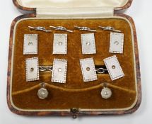 A cased George V engine turned silver and paste set eight piece dress stud set, Henry Griffith &