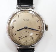 A gentleman's 1930's stainless steel Longines manual wind wrist watch, with Arabic dial and