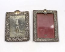 Two early 20th century repousse silver mounted rectangular photograph frames, both approximately