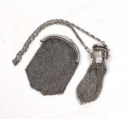 A miser's purse on suspension chain, together with a mesh evening purse.