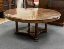 A 19th century and later circular Continental walnut low table, adapted and height reduced, diameter