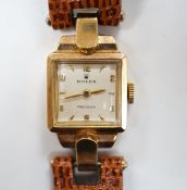 A lady's 1950's 9ct gold Rolex manual wind wrist watch, on later associated leather strap.