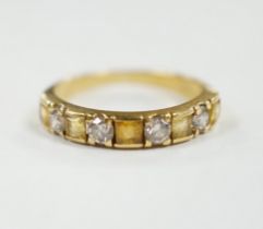 A yellow metal, five stone square cut yellow sapphire and four stone round cut diamond set half hoop