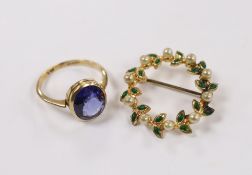 A 9ct and oval cut synthetic sapphire set ring, size P/Q, together with a costume brooch.