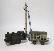 A collection of O gauge clockwork tinplate model railway, including a cast iron clockwork, GNR, 0-
