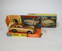 Corgi Toys James Bond's Aston Martin (261) in gold, boxed with driver, passenger, inner display
