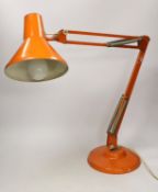 An orange Thousand and One Lamps Ltd angle poise lamp, approximately 76cm high