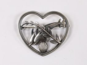 A George Jensen sterling 'twin dolphin, shell and frond' heart shaped brooch, design no. 312,