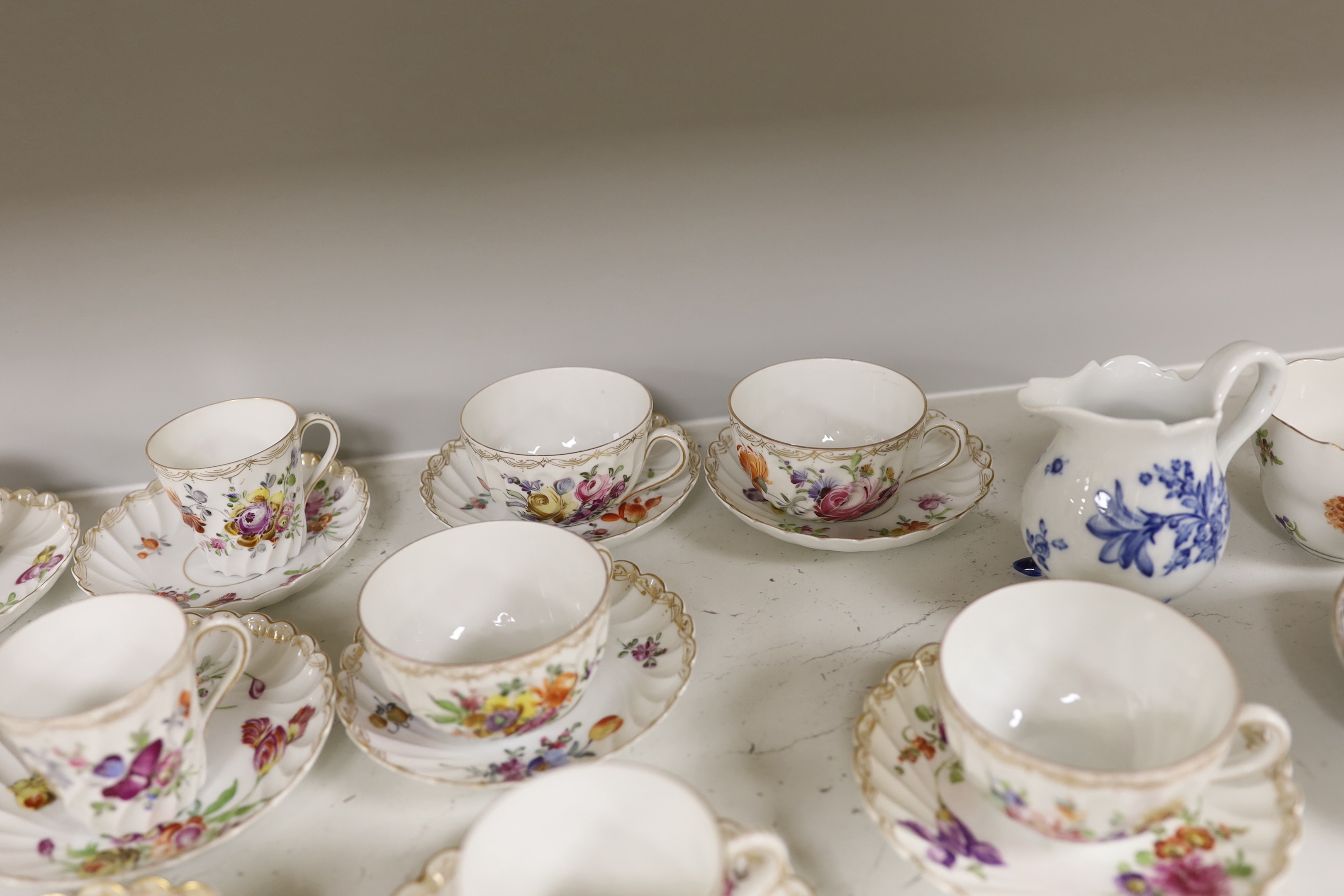 A group of porcelain Dresden tableware including cups and saucers and a blue and white jug - Image 6 of 6