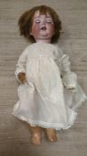 A Cuno Otto Dressel doll, bent limb, body overpainted, fingers missing on left hand, 56cm