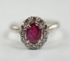 A white metal, synthetic? ruby and diamond set oval cluster ring, size P, gross weight 3.3 grams.