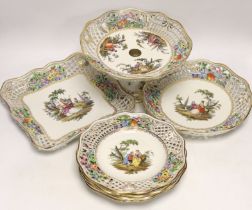 A Dresden Meissen style part dessert set, painted with courting couples in the landscape, consisting