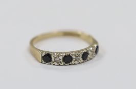 A modern 9ct gold, four stone sapphire and three stone diamond chip set half hoop ring, size N,