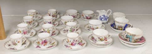 A group of porcelain Dresden tableware including cups and saucers and a blue and white jug