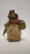 An F. Warne papier-mâché Beatrix Potter figure of Mrs. Rabbit with basket and umbrella, red and