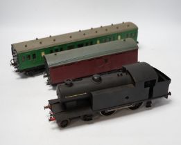 Twenty-five 0 gauge items, including; a kit built clockwork 4-4-2T locomotive with brass body and