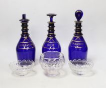 A set of three George III Bristol blue glass decanters, 25cm, and three small 19th century cut glass