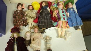 Nine assorted dolls including AMS and Kewpie
